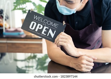 Asian Man Holding Notice Board At Cafe Shop