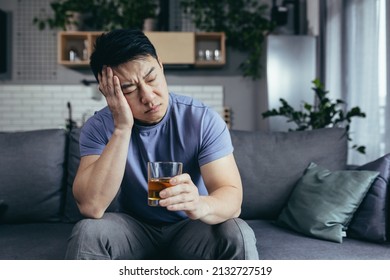 Asian Man At Home Alone, Depressed Drinking Strong Alcohol, Single Man