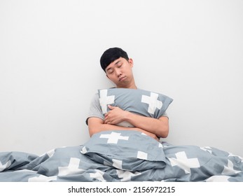 Asian Man Hugging Pillow Sleep In Bedroom