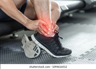 Asian Man Injury Ankle Pain After Training Running Workout In Gym Feeling So Pain,Healthcare Concept