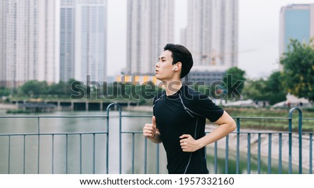 Asian man is jogging in the park
