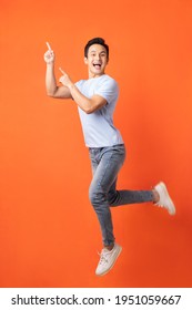 Asian Man Jumping And Pointing