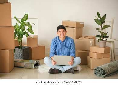 Asian Man With Laptop Planning Design Of New Flat