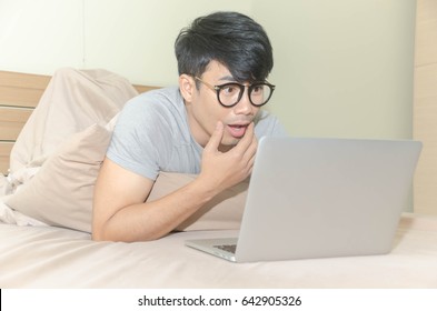 Asian Man  Lying With Laptop In Bed And Watching Pornography  Movie