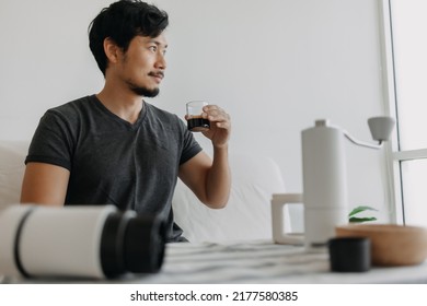 Asian man make and drink his own french press coffee. - Powered by Shutterstock