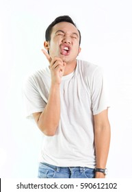 Asian Man Is Making Crazy Face. Funny Face Of Asian Man
