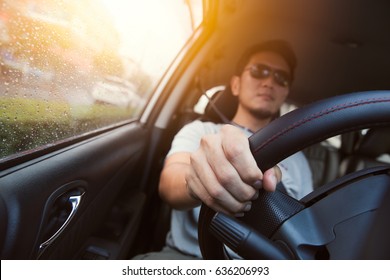 Asian Man Male Ware Sun Glass Drive A Car.