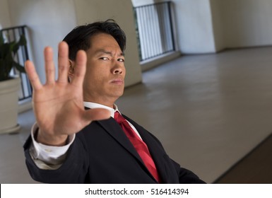 Asian Man Not Interested In What You Have To Say. Why Are You Bothering Him?