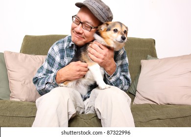 Asian Man With Pet Dog.