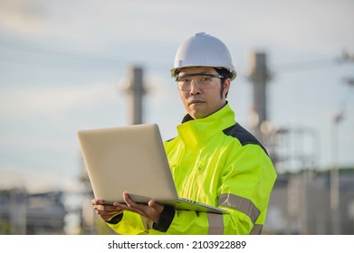 Asian man petrochemical engineer working at oil and gas refinery plant industry factory,The people worker man engineer work control at power plant energy industry manufacturing - Powered by Shutterstock