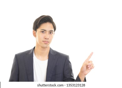 Asian man pointing with his finger.