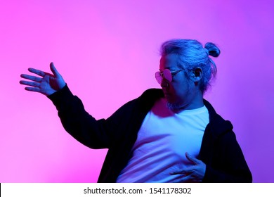 The Asian Man Posing On The White Background With The Gel Color Light.