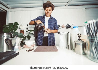 Asian Man Poured Water Of Coffee  On Cup With Equipment, Tool Brewing On Bar At Kitchen Home