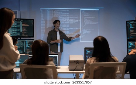 Asian man presents code using a projector during a software development meeting or coding workshop, guiding attendees through problem-solving and programming concepts in an educational setting.