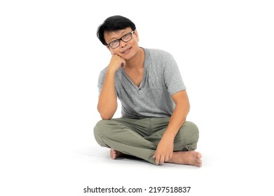 Asian Man  In A Private Suit Sitting On The Floor Isolated On White Background