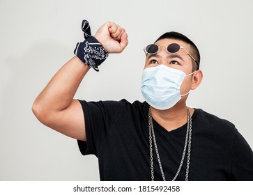 Asian Man In Rapper Style Wearing Hygienic Mask To Prevent The Virus . Hipster Man And All People In Masks To Outbreak Of Novel Corona Virus . Asian Hip Hop