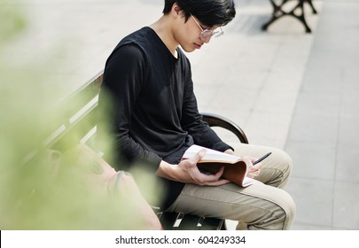 Asian Man Reading Book Relaxation