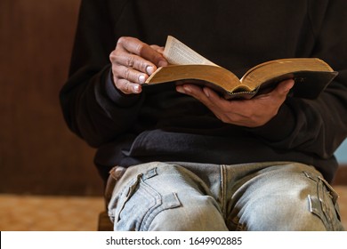 An Asian man is reading the scripture or holy bible. God's teachings according to belief and faith in God. Religion Concept - Image