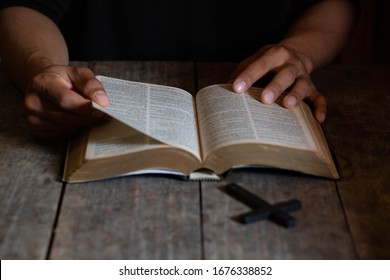An Asian man is reading the scripture or holy bible. God's teachings according to belief and faith in God. Religion Concept - Image
