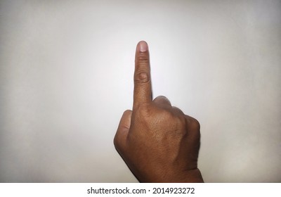 asian man right hand with calloused index finger pointing up