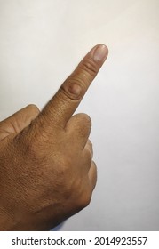 asian man right hand with calloused index finger pointing up