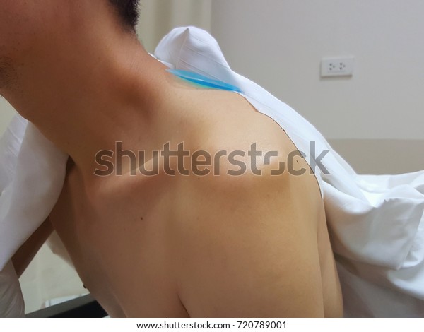 Asian man with shoulder\
dislocation