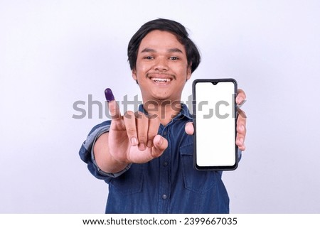 Asian man showing blank screen smart phone for mockup and finger after voting on Indonesia presidential election 
