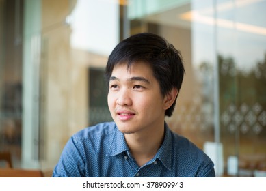  Asian Man Sitting At Coffee Shop