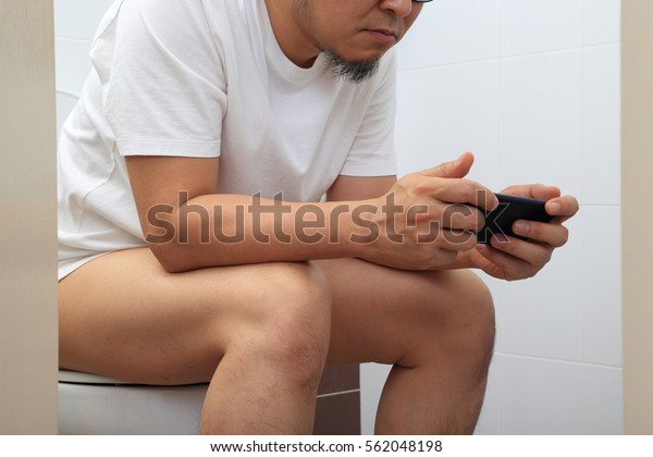 Asian Man Sitting Water Closet Stock Photo Edit Now 562048198