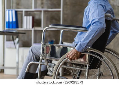 Asian Man Sitting In A Wheelchair And Work On The Computer At Home The Concept Of Technology For Convenience