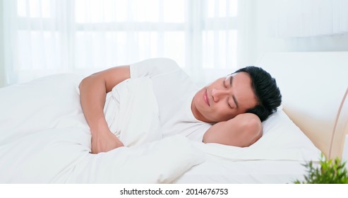 Asian Man Sleep Well On Bed In The Morning At Home