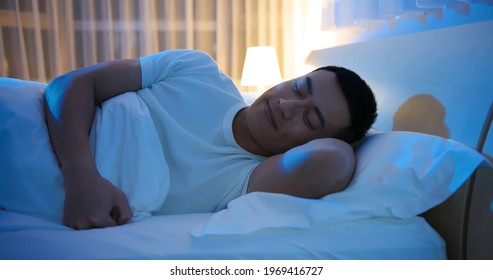 asian man sleep well with smile at night 