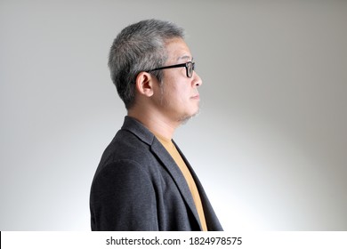 The Asian Man In Smart Casual Standing On The White Background.