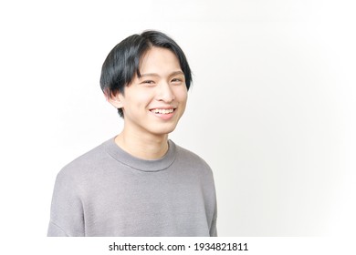 Asian man smiling on white