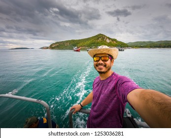 Asian Man Smiling And Selfie On Board During The Trip.