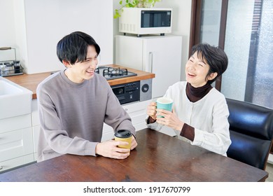 Asian man talking his mother at home