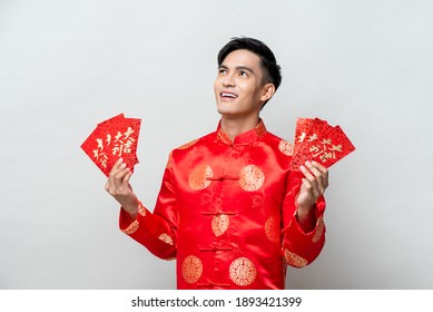 Asian Man In Traditional Oriental Costume Holding Red Envelopes Or Ang Pao With Text Mean Lucky - Wealthy For Chinese New Year Concepts