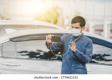 Asian Man Use Face Mask Are Video Call On Mobile Phone Standing At Car In City Focus On Phone