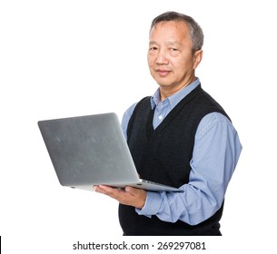 Asian Man Use Of Notebook Computer