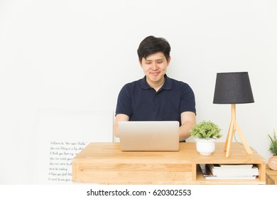 Asian Man Using Laptop