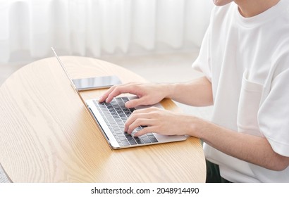 Asian Man Using The Laptop, No Face