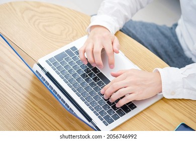 Asian Man Using The Laptop, No Face