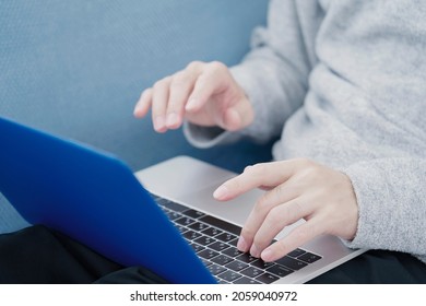 Asian Man Using The Laptop, No Face