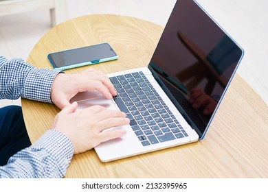 Asian Man Using The Laptop, No Face