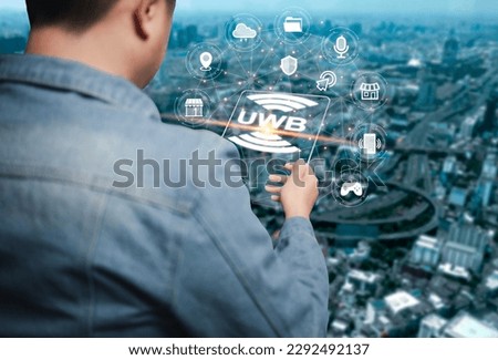 An Asian man is using a smartphone to connect ultra-wideband UWB as a short-range radio communication technology. Works similarly to Bluetooth and Wi-Fi.