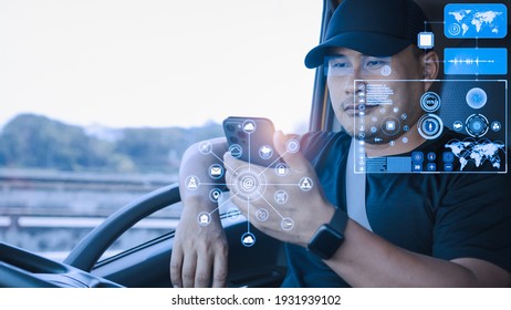 Asian man using smartphones check data digital. High-tech truck driver Find location 3D world map application touch screen display realistic. Transport, Delivery, and driving tracking technology. - Powered by Shutterstock