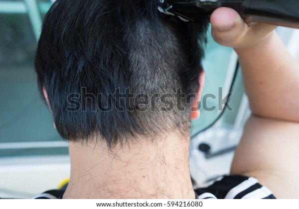 Asian Man Using Yellow Electrical Hair Stock Photo Edit Now