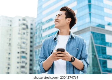 Asian man walking on the street - Powered by Shutterstock