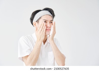 Asian Man Washing His Face With Facial Cleansing Foam