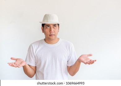 Asian Man Wear White Hat Raise Hand Up With Boring Expression Emotion At White Wall Background.looking Up